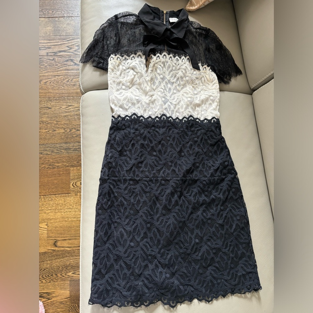 Sandro best seller lace dress with ribbon detail on neck